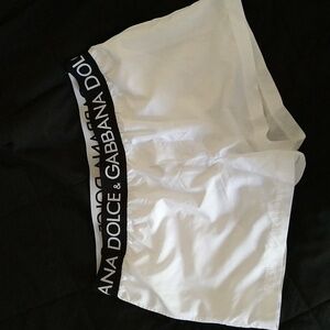 Dolce & Gabbana swim trunks. White with black waist ban. Size medium